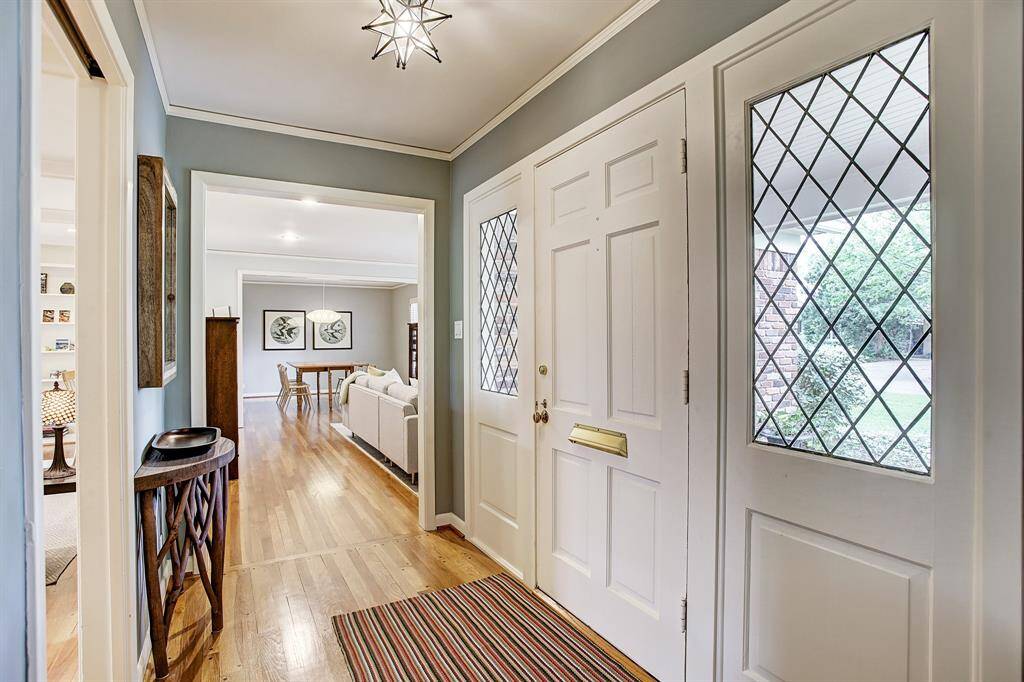 Welcome home! Spacious light filled entry. Gleaming hardwoods throughout! Exquisite Sidelights.