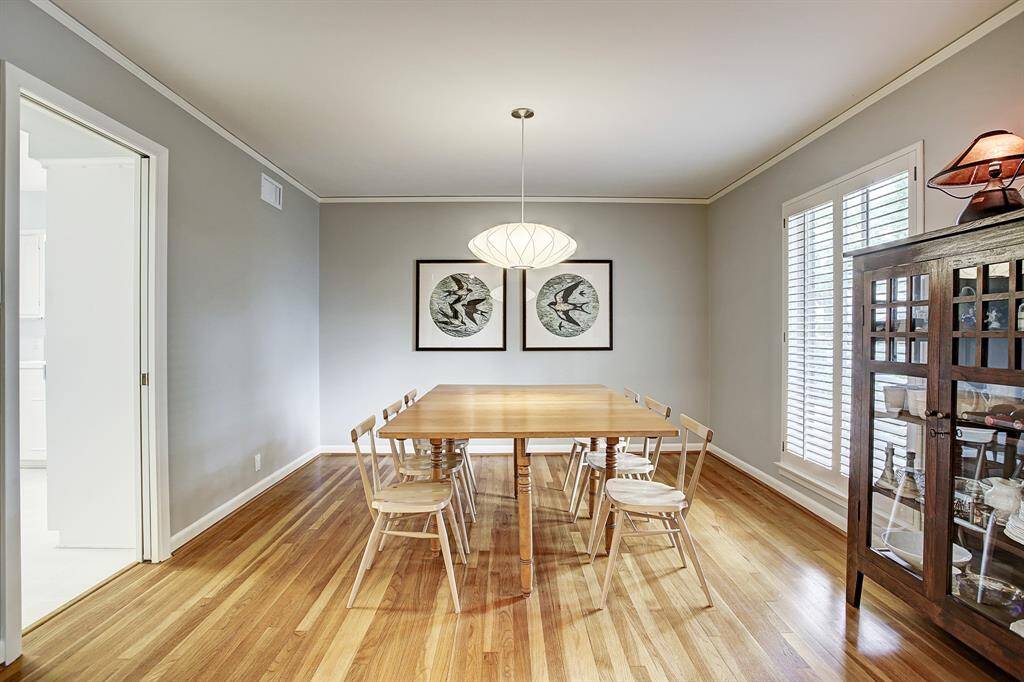 Spacious dining room overlooks front yard. Large window, exquisite chandelier & crown molding.