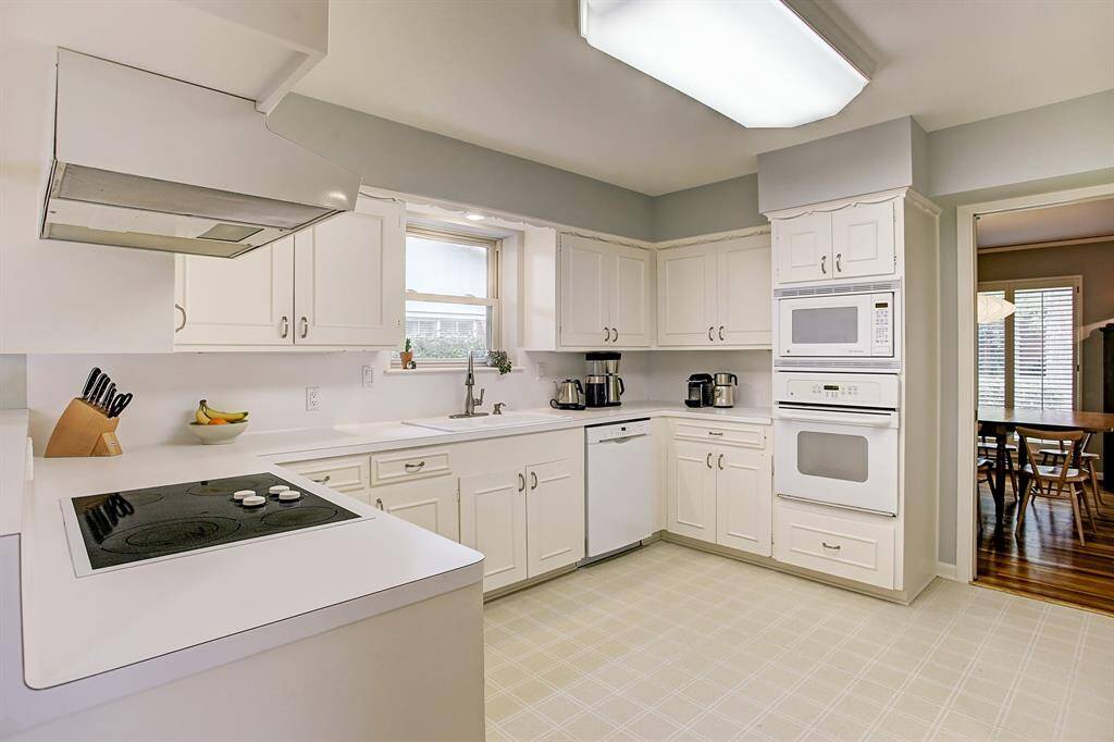 Kitchen boasts double sink, Pantry & recent windows. Flows well to dining room & living areas.