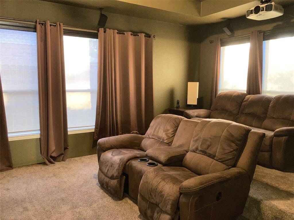 Fully furnished media room.