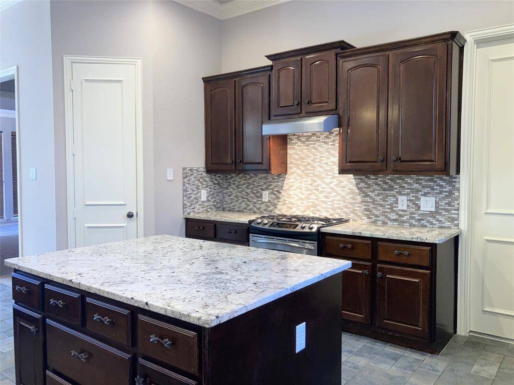 Large center island with extra storage gas range
