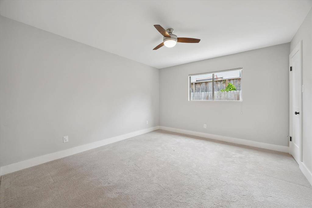 The secondary bedroom is tucked along the west side at the back of the home. The carpets were recently professionally cleaned, ensuring a fresh and move-in ready feel.