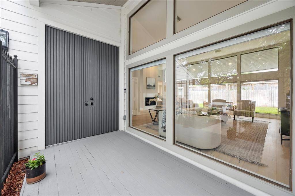 The front porch offers quite the first impression with large windows and a impressive front door entrance.