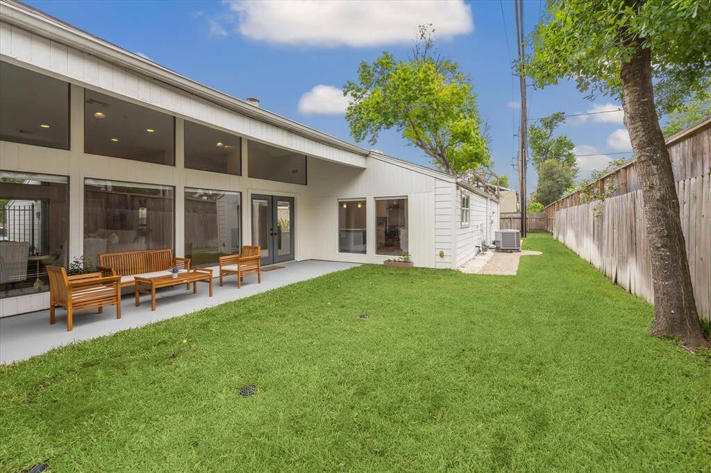 Another view of the backyard, highlighting the additional yard space to the south side of the yard.