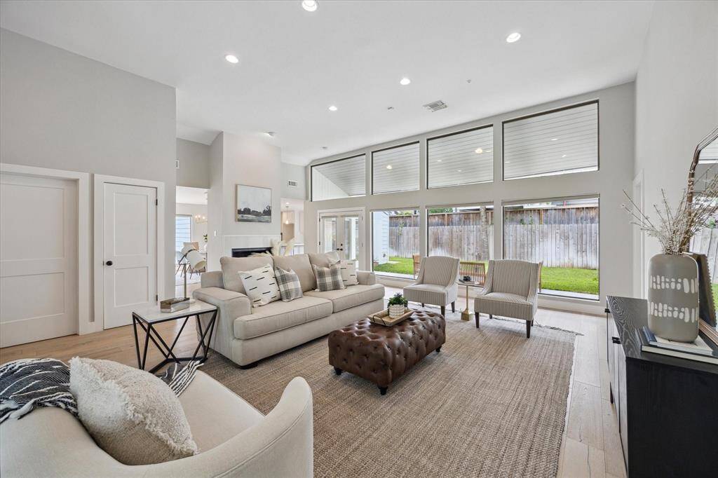 ..and back yard. Framed by large windows, the living room feels light, airy, and effortlessly welcoming—an ideal space to exhale and unwind.