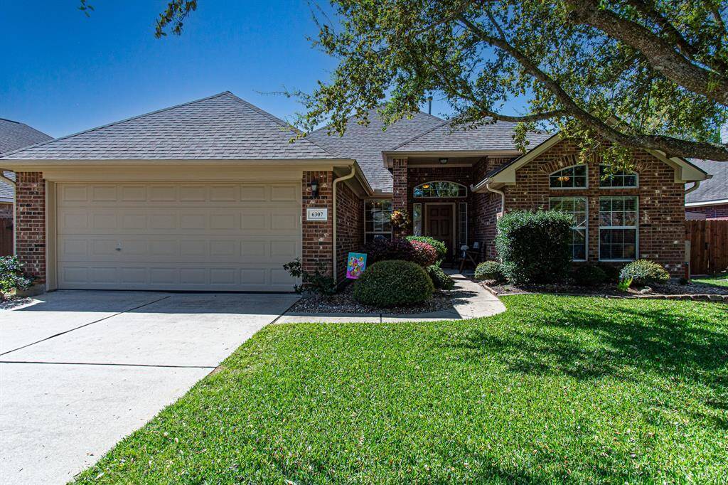 Welcome Home to Pine Lakes in Old Katy! Your new home has a beautiful view of the neighborhood pond & mature trees! Keep scrolling!