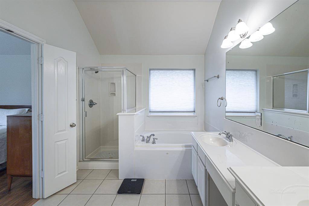 This alternative bathroom view showcases the separate shower enclosure, highlighting a key feature of this great space.