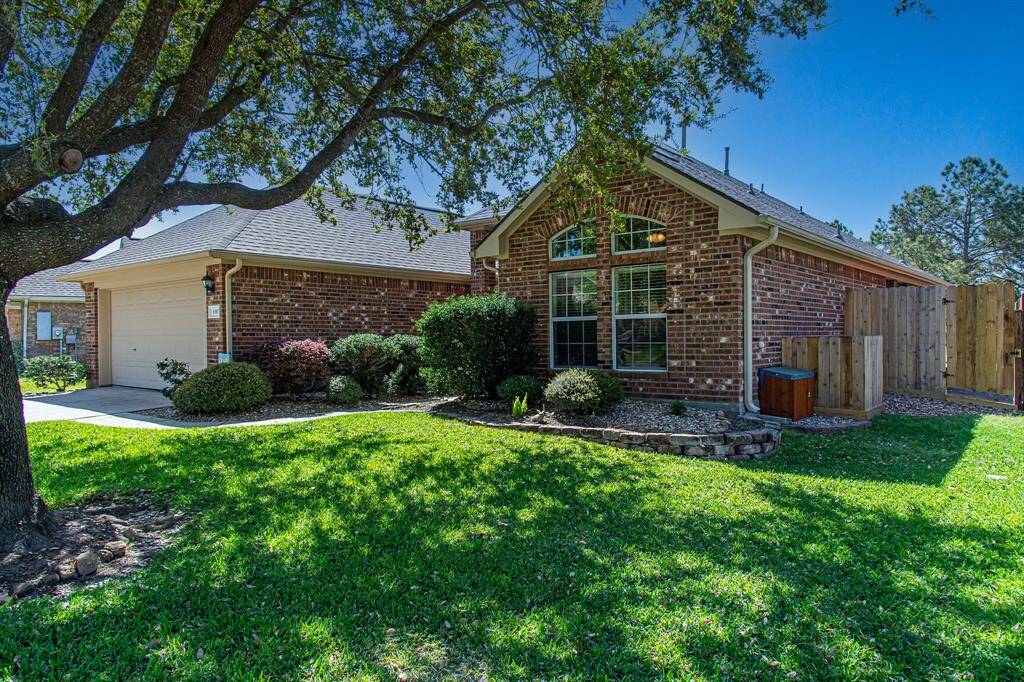 Enjoy beautiful & low maintenance landscaping along with a big, beautiful mature oak tree!