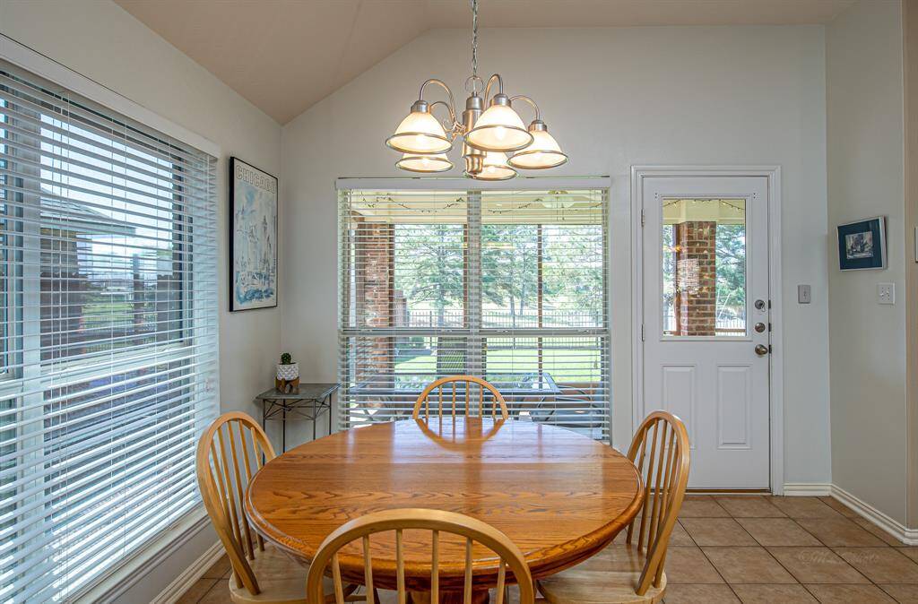 Step from the kitchen into the breakfast room and discover a back door leading to an inviting screened porch. Relax and enjoy the picturesque pond views in this tranquil outdoor extension