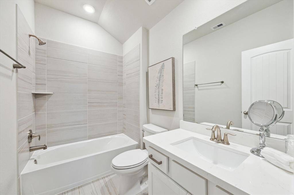 Upstairs bathroom off the bonus area and third bedroom.