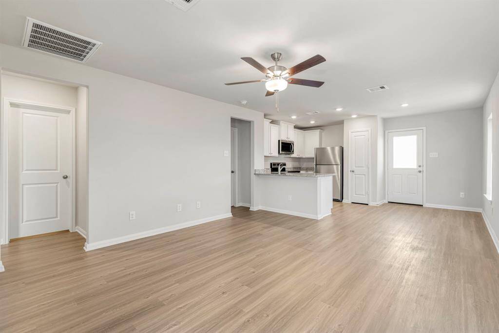 The living room has plenty of space to gather with your family and friends.