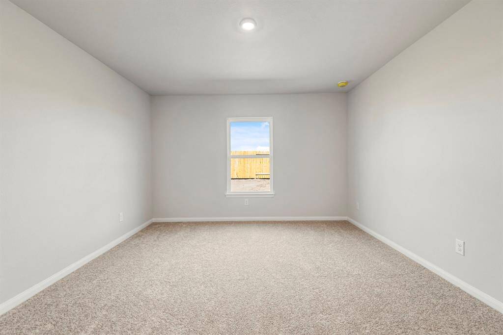 The primary bedroom is a great place to relax after a long day, and it’s large enough for the king-sized bed!