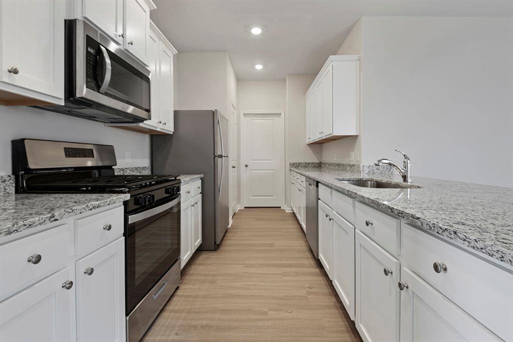 The open concept in the living room offers plenty of space to gather with your family and friends.