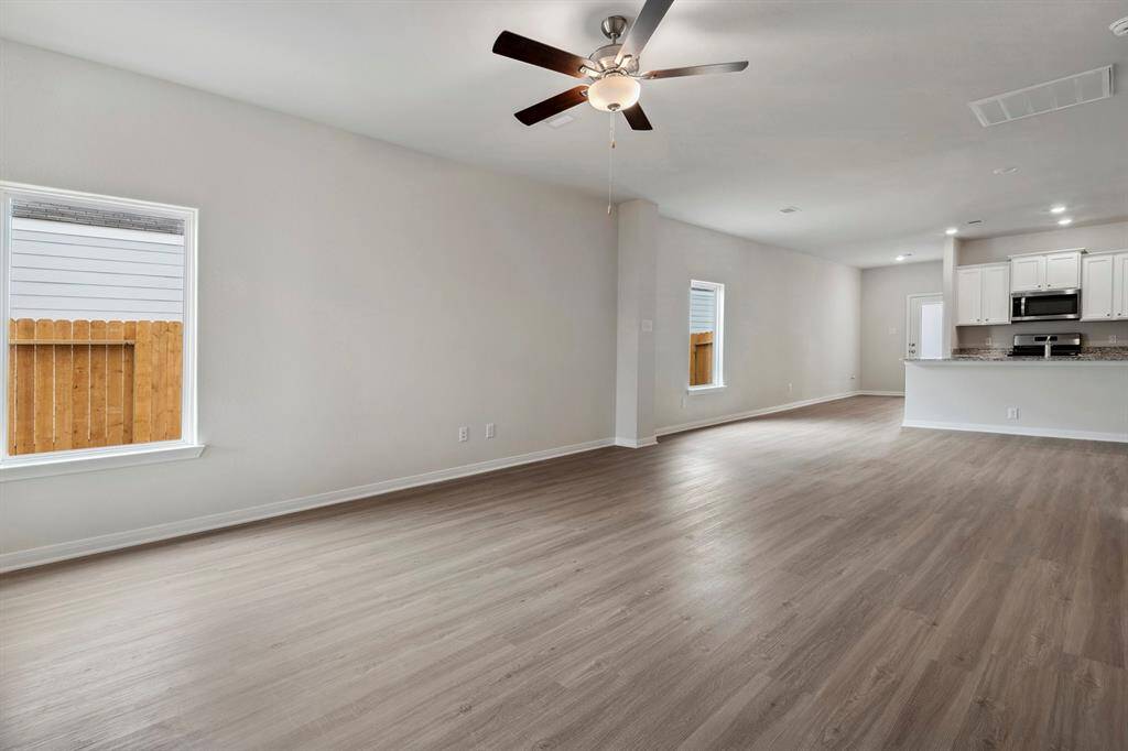 The open concept in the living room offers plenty of space to gather with your family and friends.