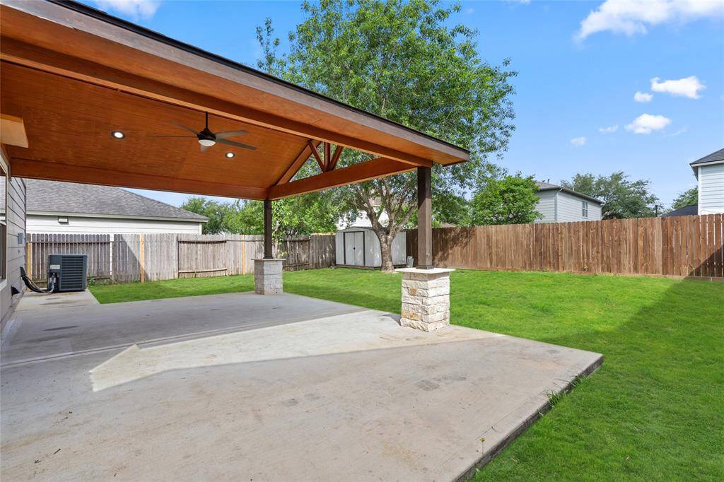 This view of your backyard, patio and shed.