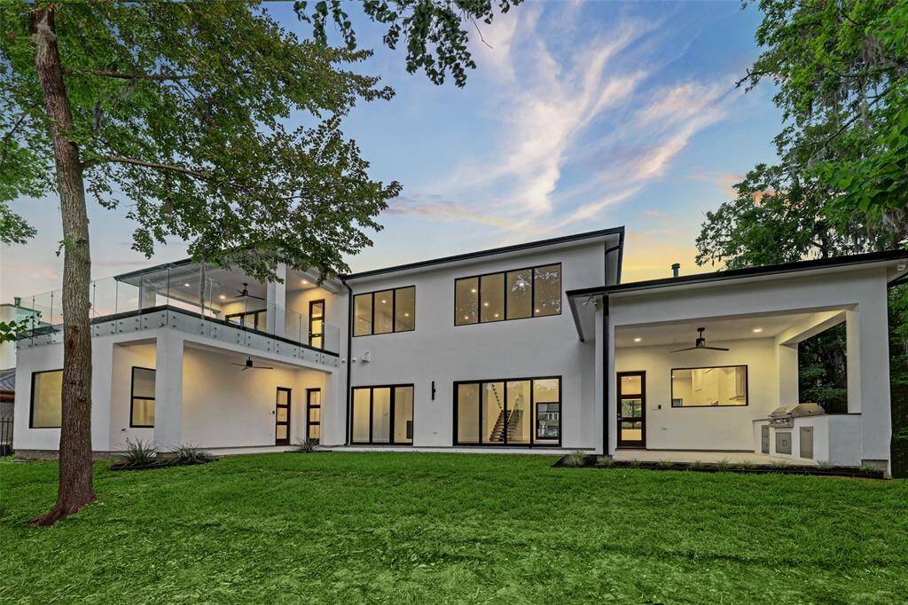 True lot size can be viewed on the massive glass enclosed walk out balcony pictured top-left.