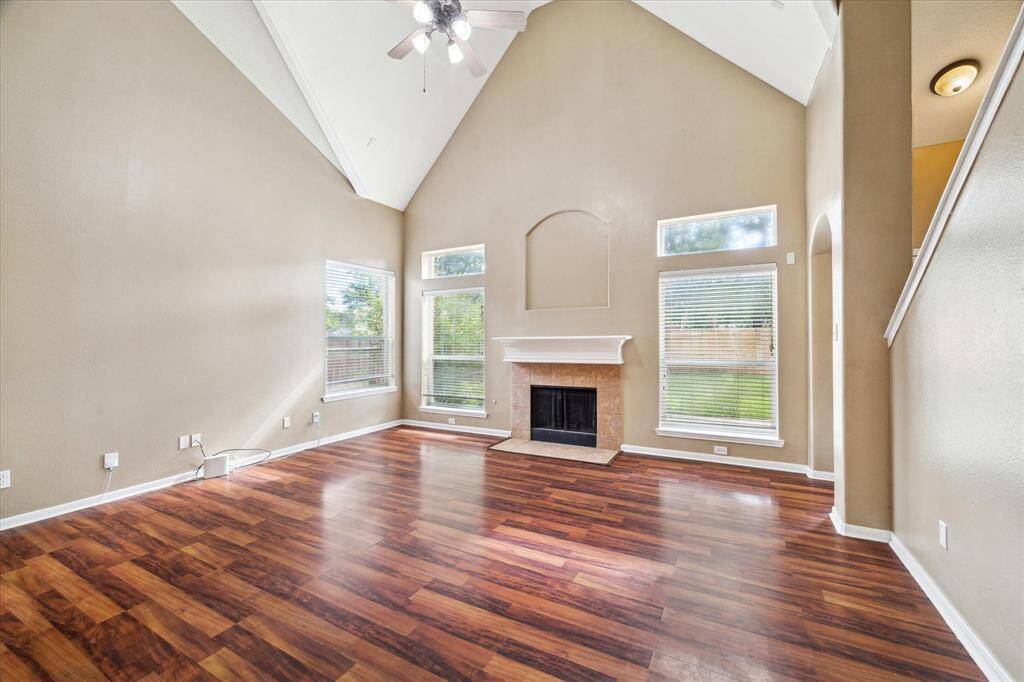 Living room with vaulted ceilings & fireplace