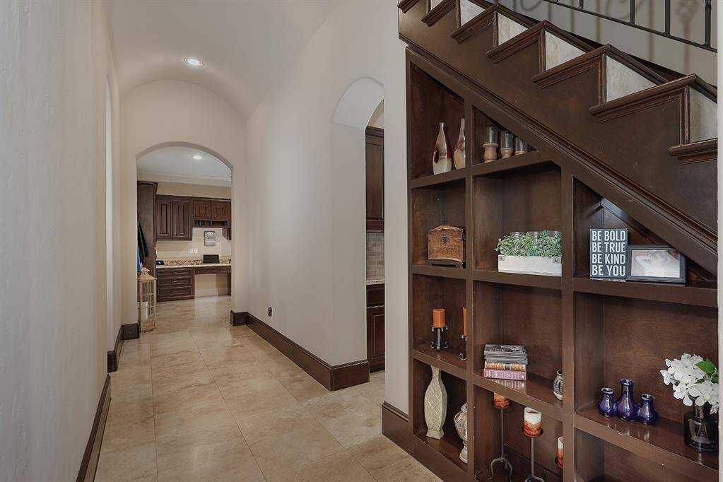 Pass through hallway to the garage, mud room, and utility areas
