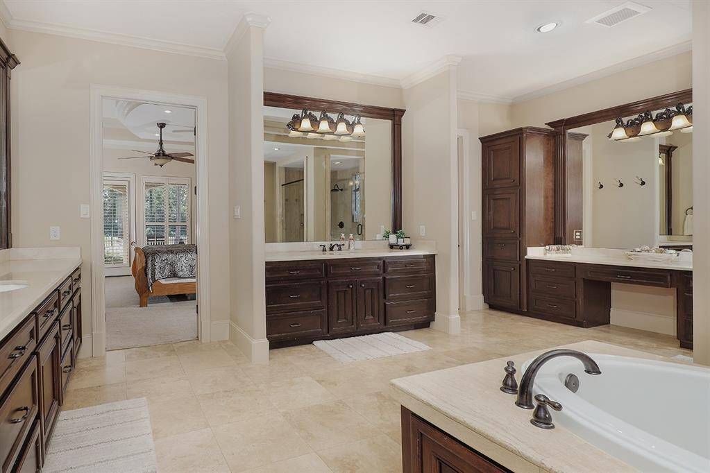 Spa-like primary bathroom with separate vanity area