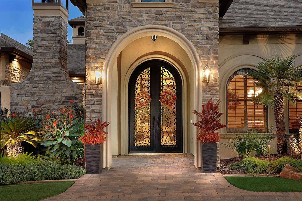Welcoming grand, double-steel front doors