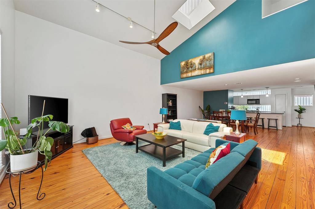 This room is bathed in sunlight and features a skylight in the vaulted ceiling.