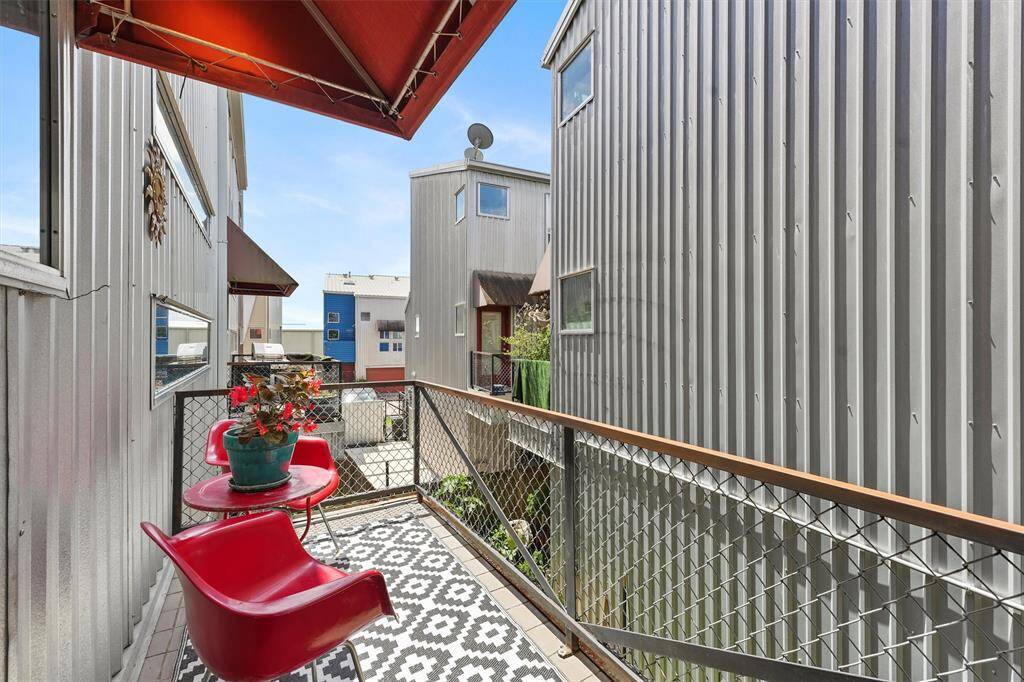Second-floor balcony right off the kitchen is a great place to grill, expand your urban garden or entertain friends.