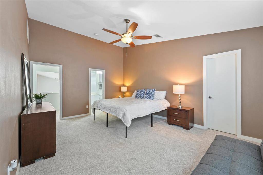 Private primary suite on the third floor features vaulted ceiling and a walk-in closet. Notice the bonus room in the corner.