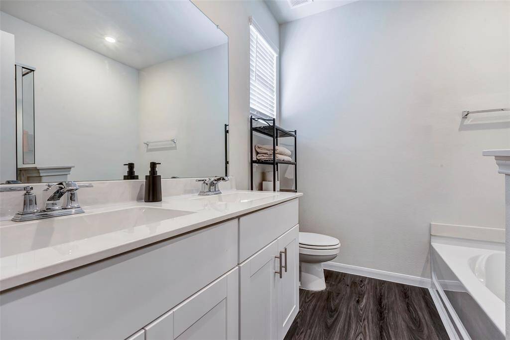 A blend of style and functionality with double sinks in the master bathroom.