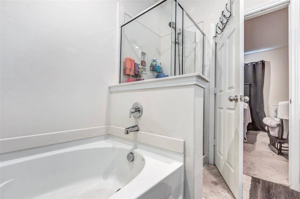 A separate shower and tub in the master bathroom.