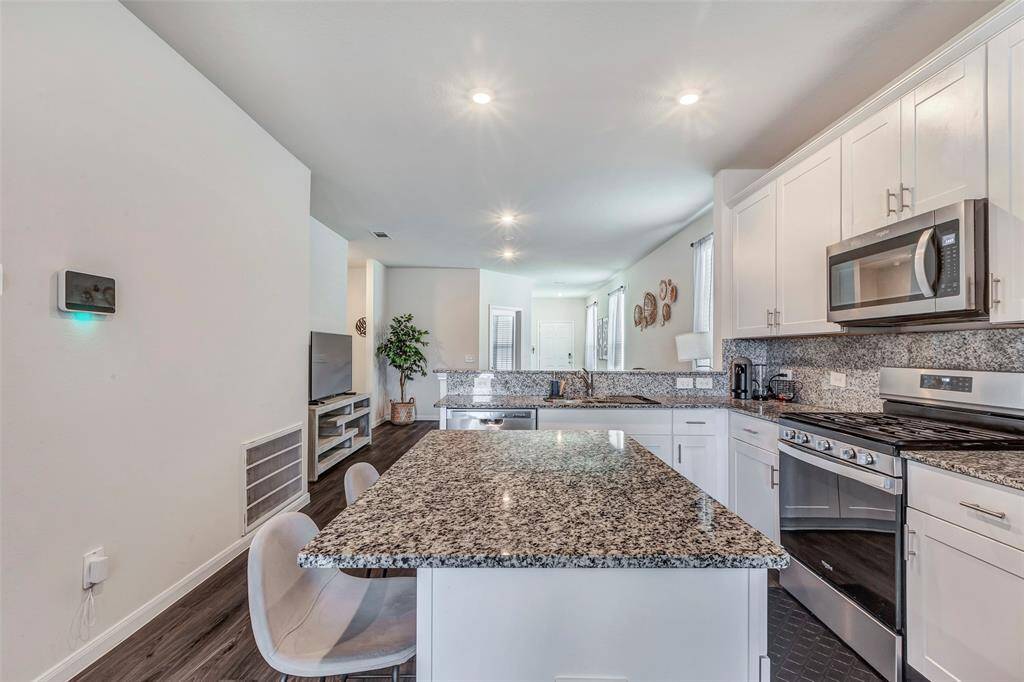 The kitchen island provides extra seating!