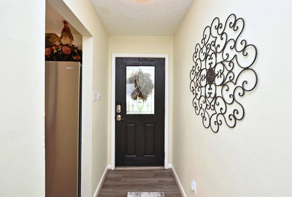 Stained glass and wood door welcomes you home!