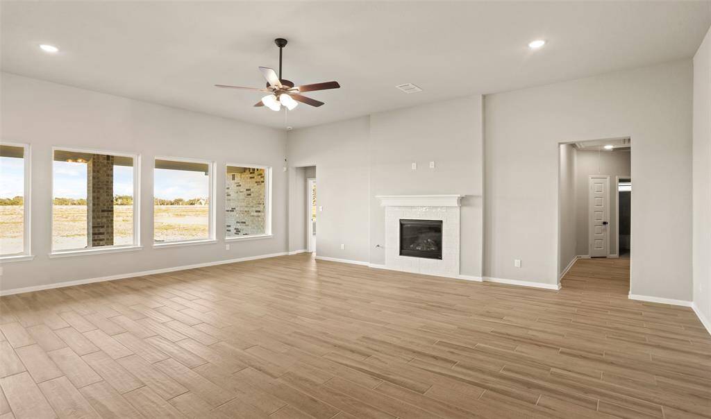 Great room with cozy fireplace (*Photo not of actual home and used for illustration purposes only.)
