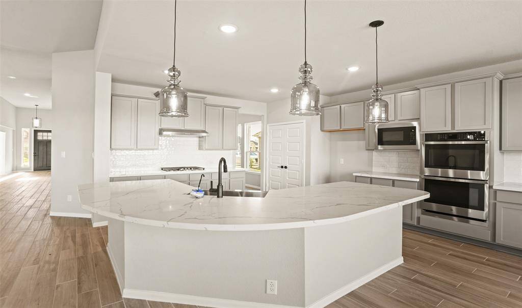 Gourmet kitchen with corner island (*Photo not of actual home and used for illustration purposes only.)