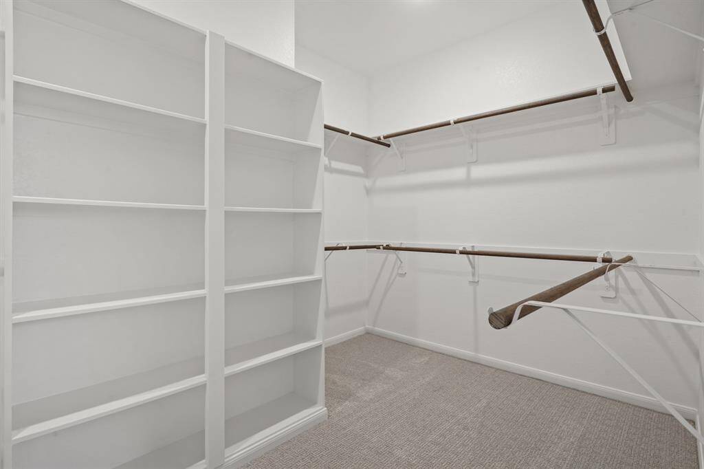 Walk-in closet in owner's suite (*Photo not of actual home and used for illustration purposes only.)