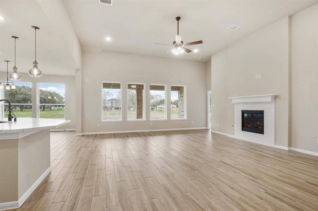 Great room with cozy fireplace (*Photo not of actual home and used for illustration purposes only.)