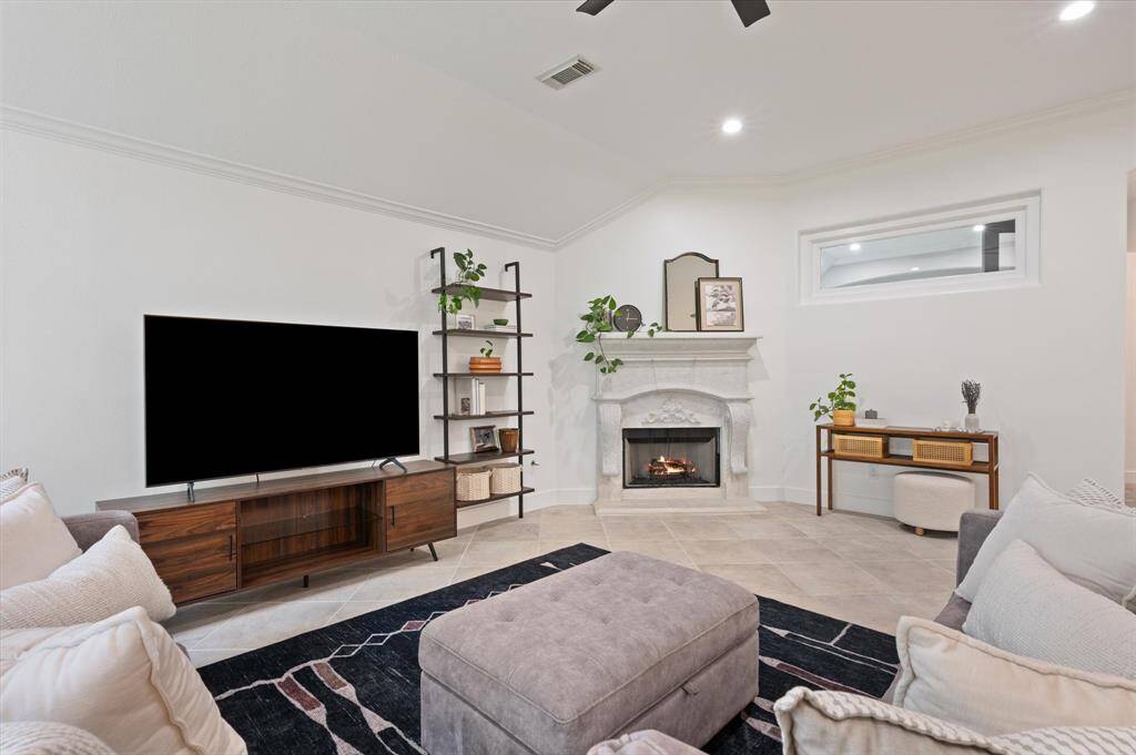 This spacious living room offers plenty of room for your sectional or sofa and loveseat, with a sizable wall perfect for your media unit. Don’t miss the unique window that connects the office and living room, adding both character and dimension.