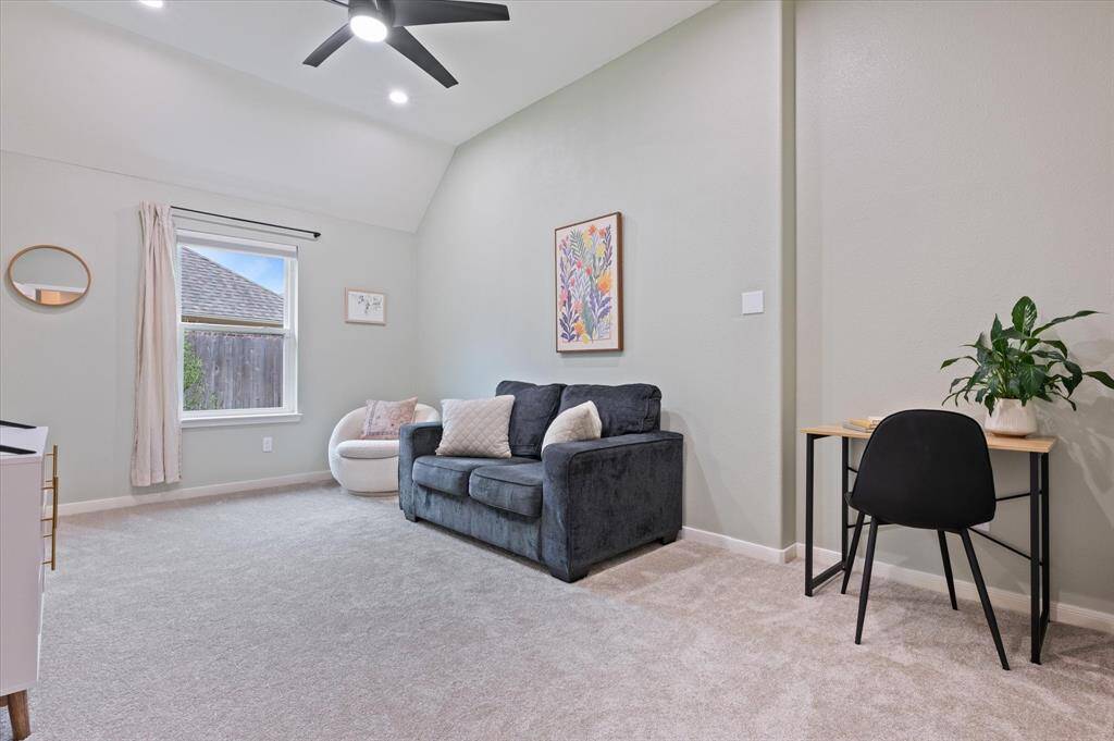 This versatile extra room offers endless possibilities—whether used as a bedroom, workout space, or flexible living area. Features include recessed lighting, neutral paint tones, and a modern ceiling fan, ensuring both style and functionality.