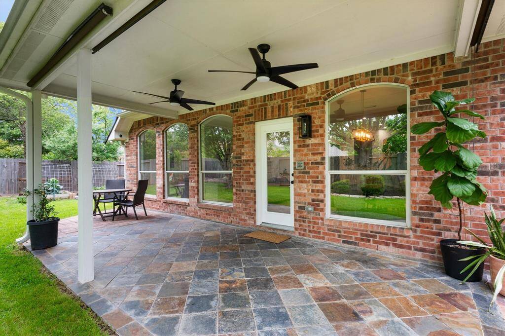 Imagine relaxing here every day on your extended covered patio, where you can unwind in peace and comfort. There's plenty of space for your favorite outdoor seating, and dual ceiling fans provide a gentle breeze, ensuring ultimate relaxation in your private outdoor retreat.