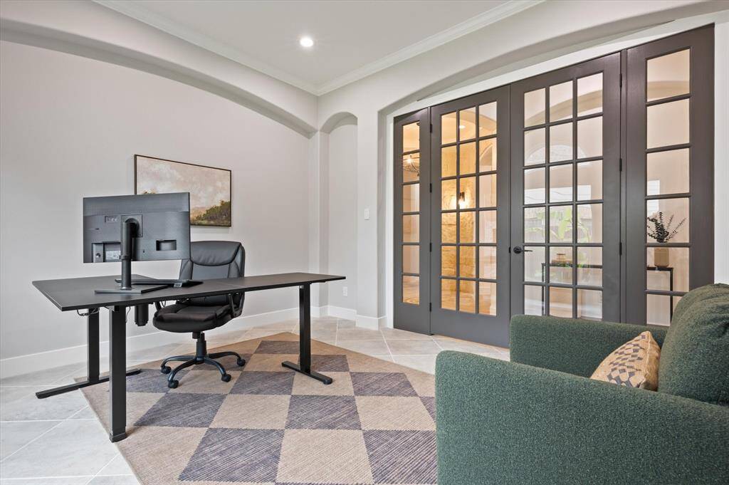 Enclosed by custom doors that enhance the room's character, this office offers a private, quiet retreat—perfect for productivity or as a sophisticated workspace.