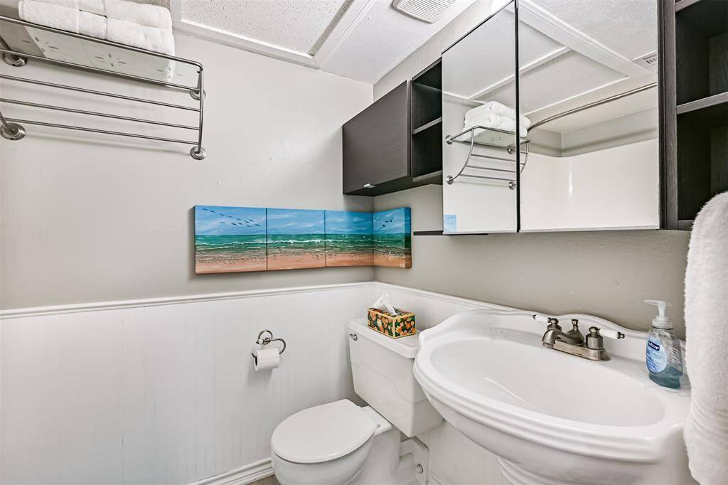 Pictures over toilet are excluded from sale.