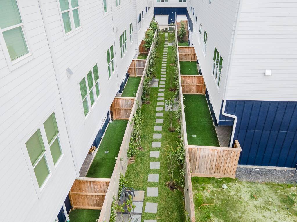 Courtyard area behind your private fenced in back yard.  Walk the dog or sit on a bench and relax.