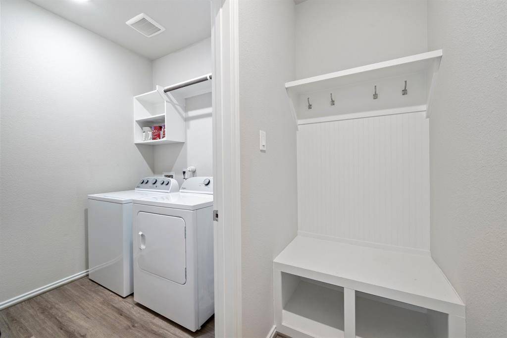 Mud room / laundry room with washer and dryer included in the lease.