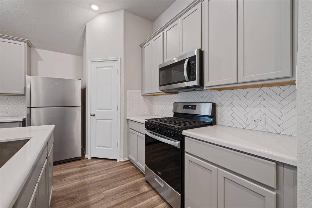 Gas oven, microwave, fridge is included, walk-in pantry.