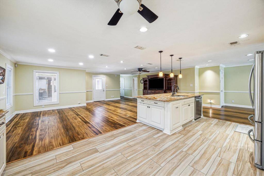 Kitchen overlooks the family room and dining area, creating a perfect space for seamless interaction.