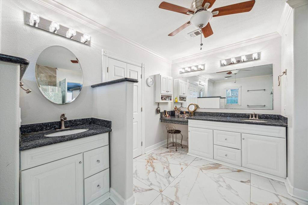 Primary bathroom features a double vanity, offering ample space for convenience and comfort.