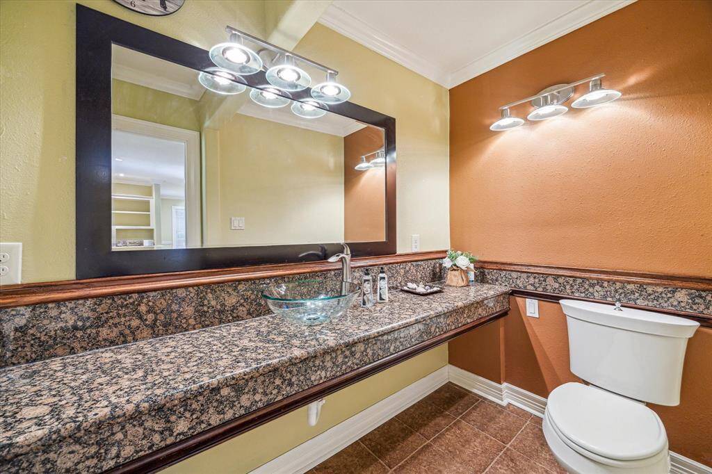 Half bathroom featuring a spacious countertop, offering extra room for convenience and functionality.