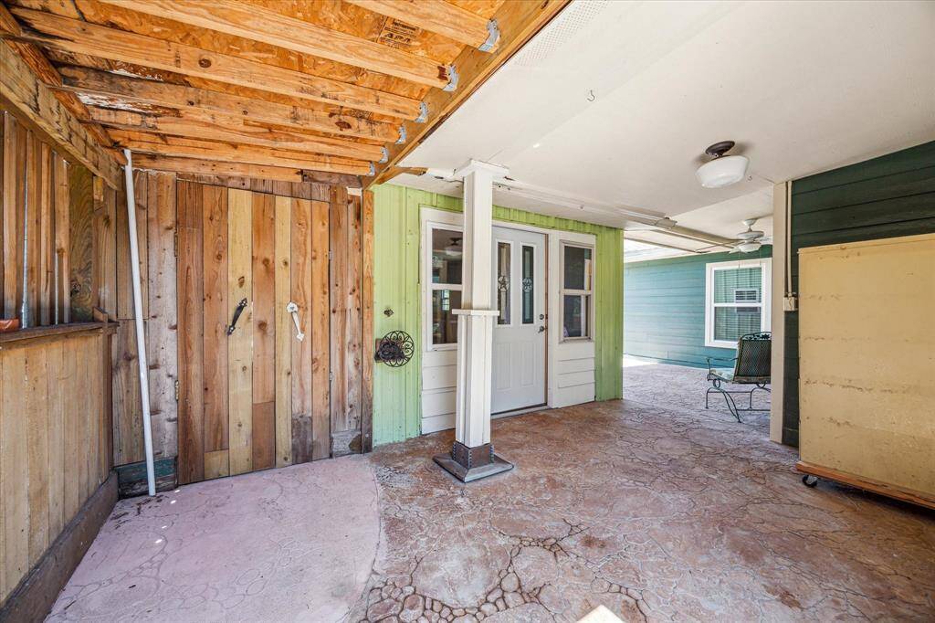 Additional covered storage area in the backyard, offering extra space for tools, equipment, or outdoor essentials.