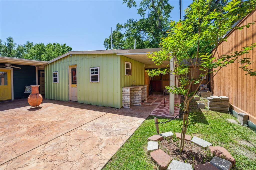 Outdoor sink and gas line located under the covered patio, providing added convenience for cooking and outdoor activities.