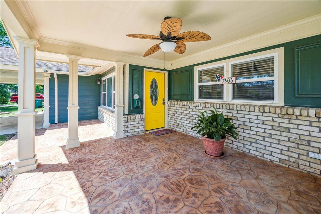 Spacious covered patio welcomes you at the front entrance—ideal for outdoor seating or décor.