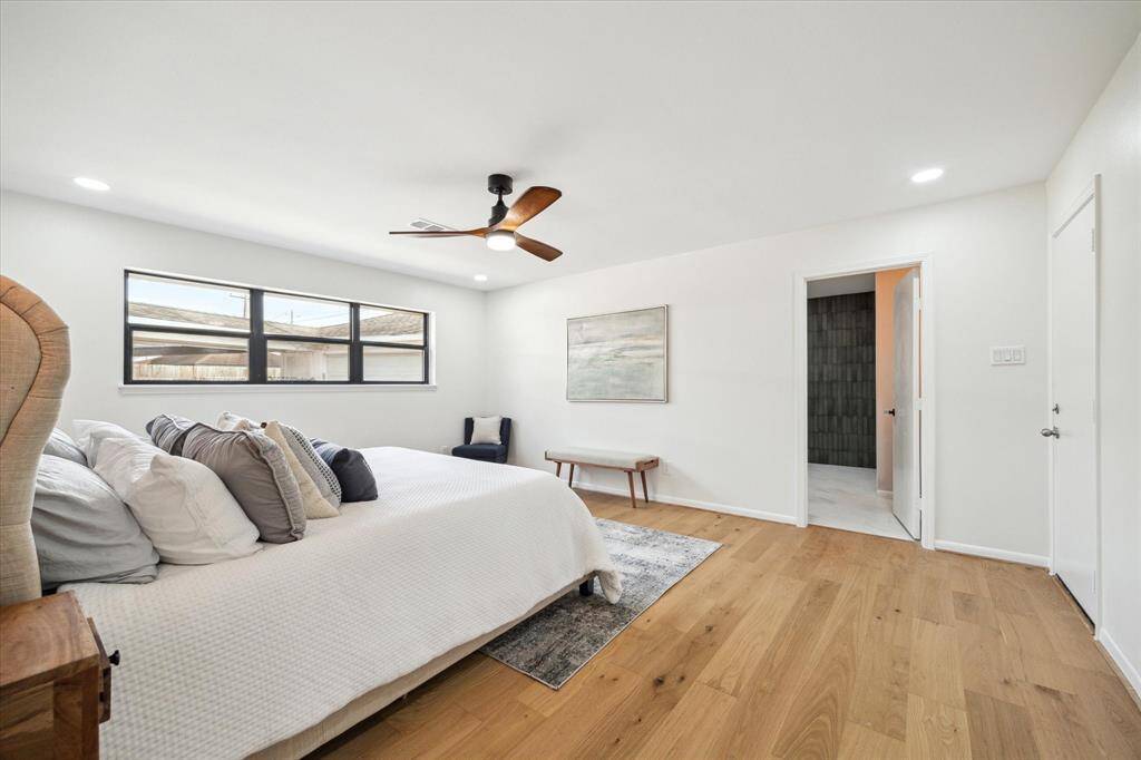 Luxurious primary bedroom with a spacious en suite bath.
